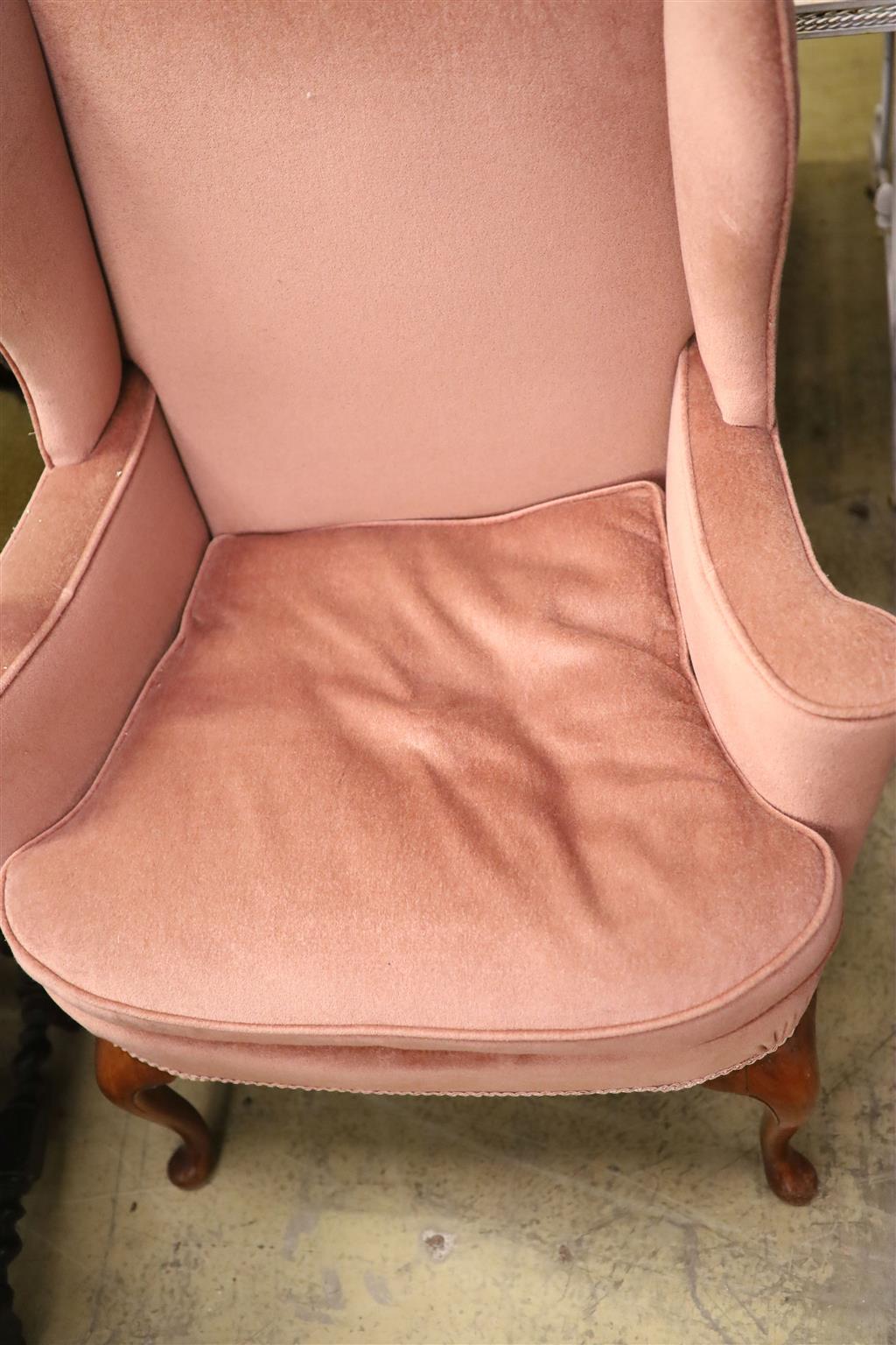 A Queen Anne style wing armchair upholstered in pink dralon, width 82cm, depth 66cm, height 101cm